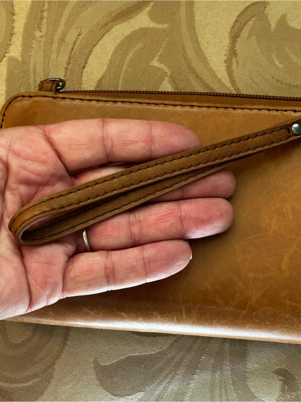 The Sak Smartphone Wristlet Wallet Iris Tobacco Brown Flower Embossed